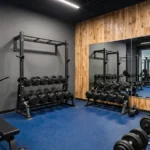 A foldable treadmill placed in a modern home gym setup.