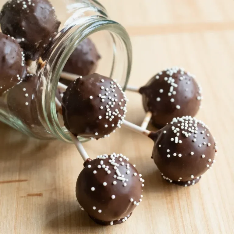 Homemade Starbucks-inspired cake pops displayed on a wooden table
