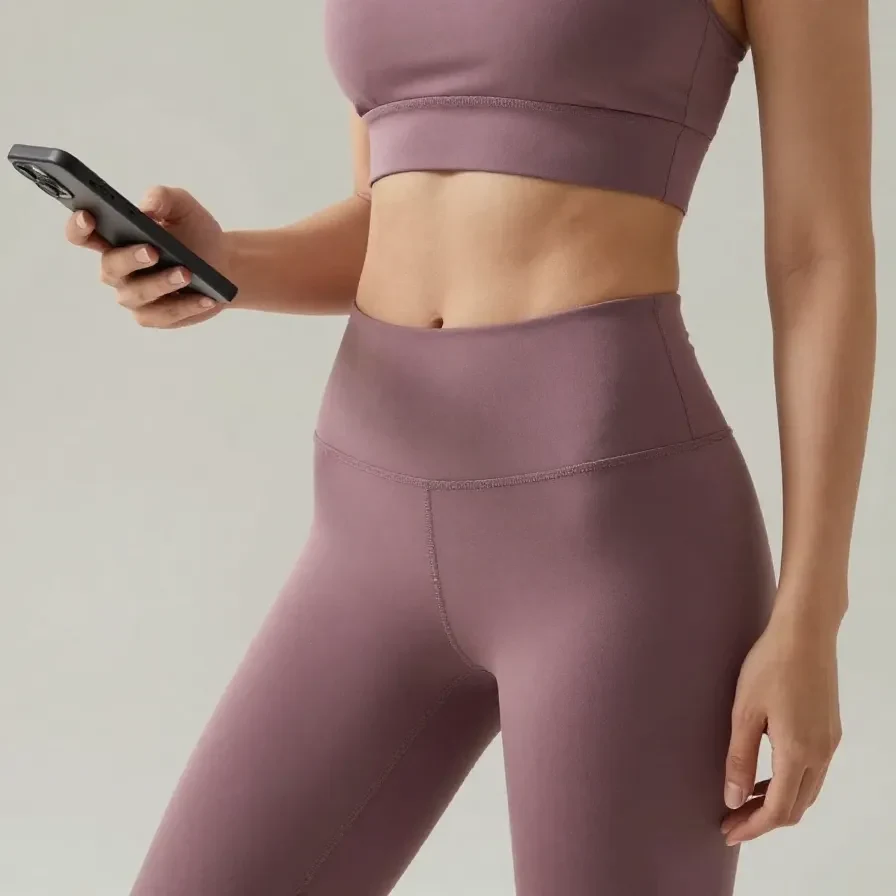 Woman practicing yoga in technical athletic fit activewear