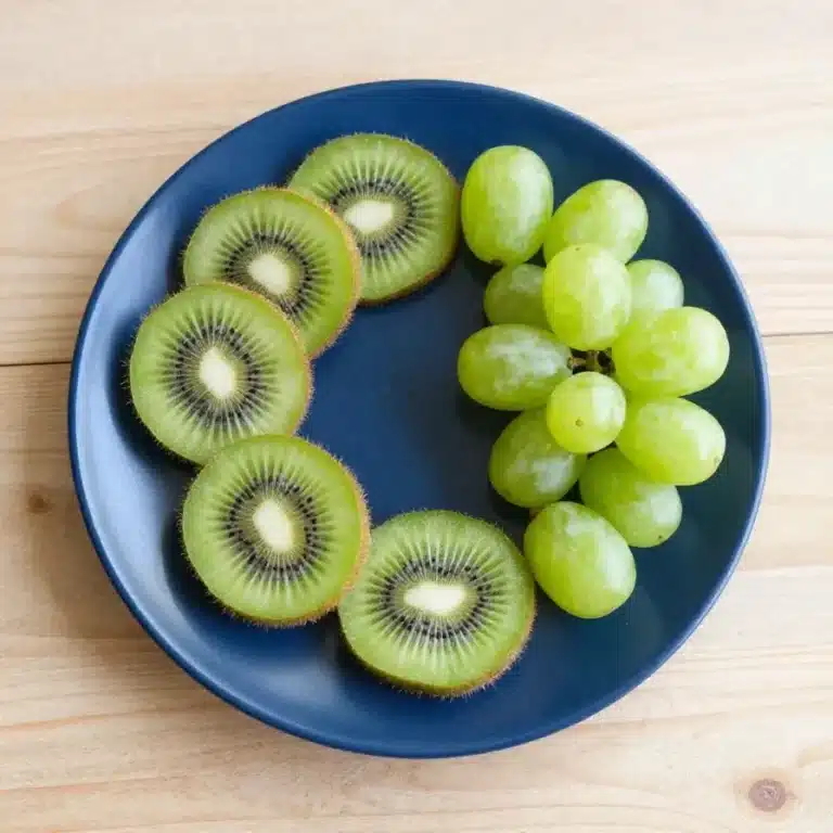 A creative food art featuring a kiwi turtle made from sliced kiwi fruit, perfect for kids' snacks.