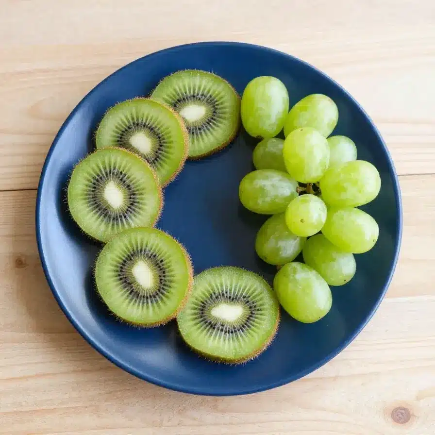 A creative food art featuring a kiwi turtle made from sliced kiwi fruit, perfect for kids' snacks.